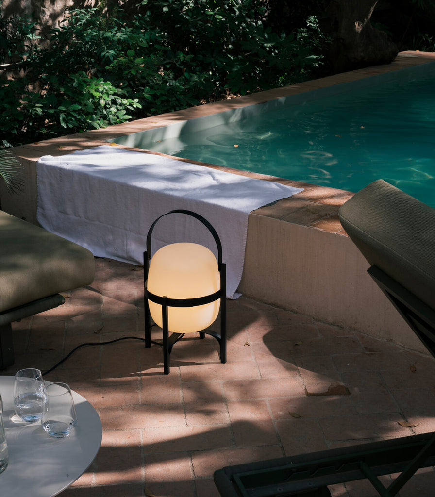 Santa & Cole Cesta Outdoor Table Lamp featured within outdoor space