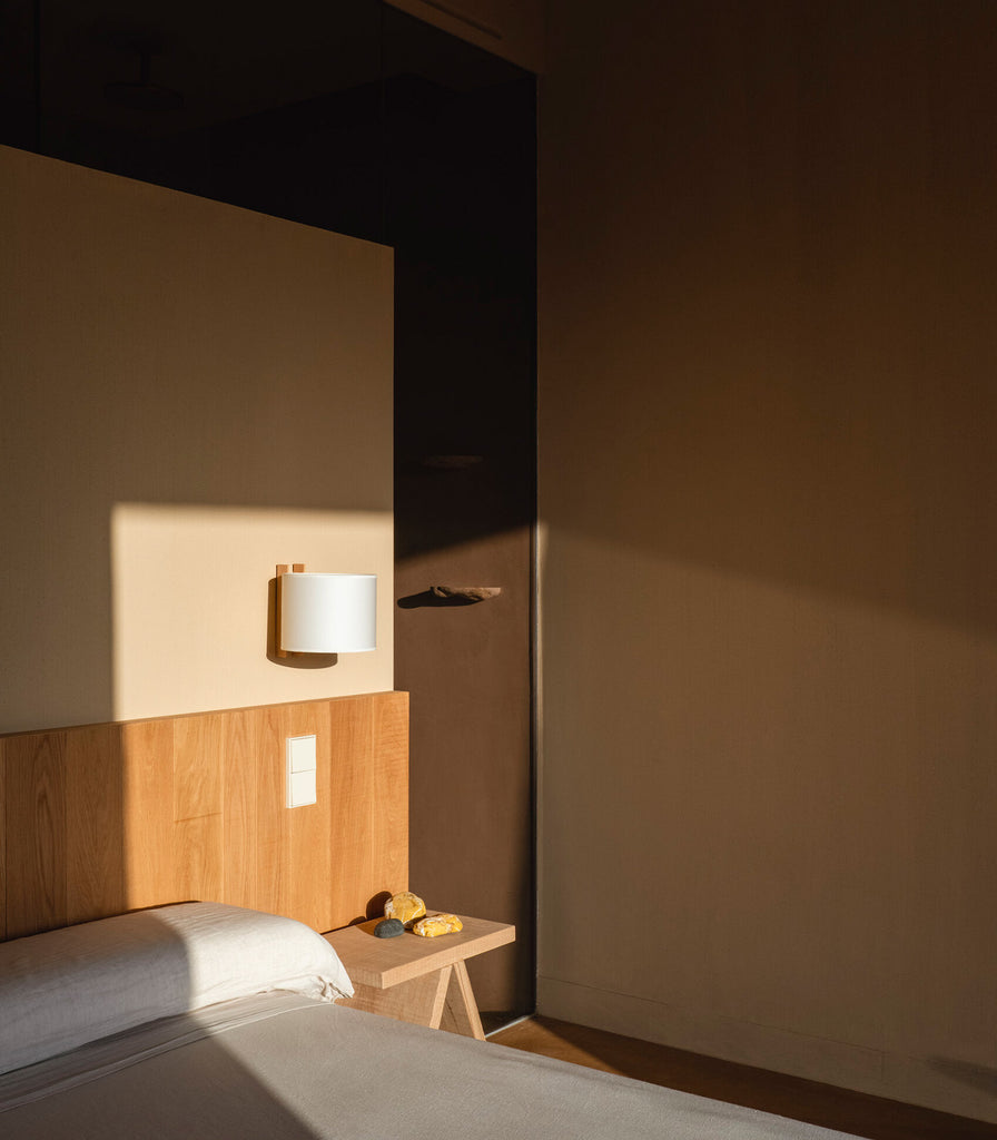Santa & Cole TMM Corto Wall Light featured in a bedroom