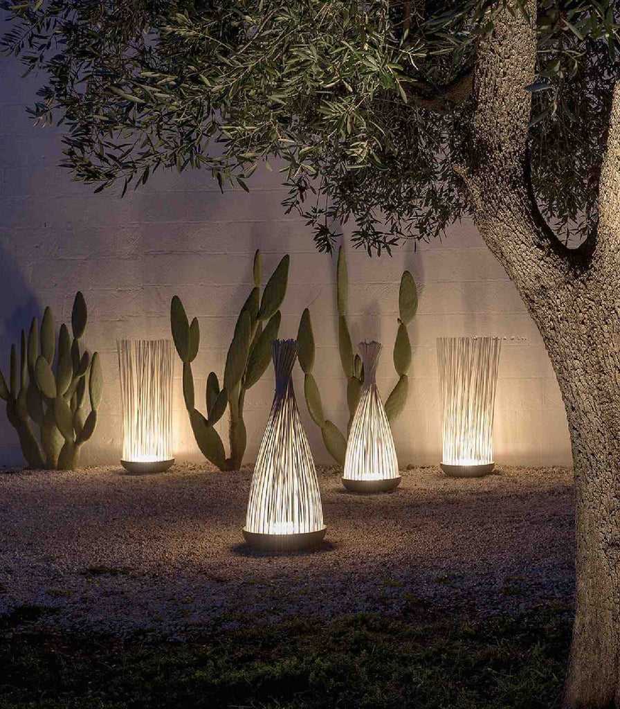 Karman Don't Touch Outdoor Floor Lamp featured within a outdoor space
