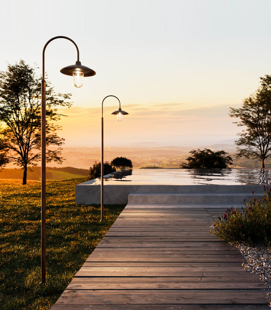 Il Fanale Barchessa Curve Pole Light featured within a outdoor space