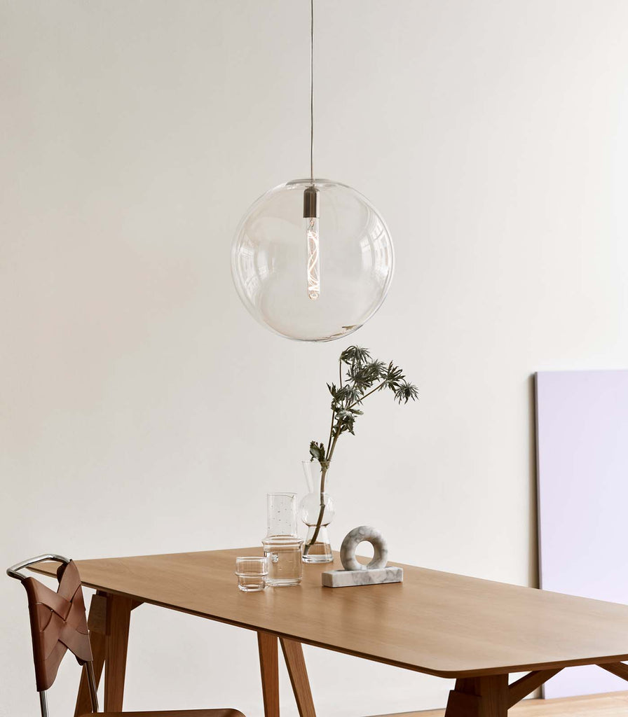 Nordic Fusion Luna Clear Pendant Light hanging over dining table