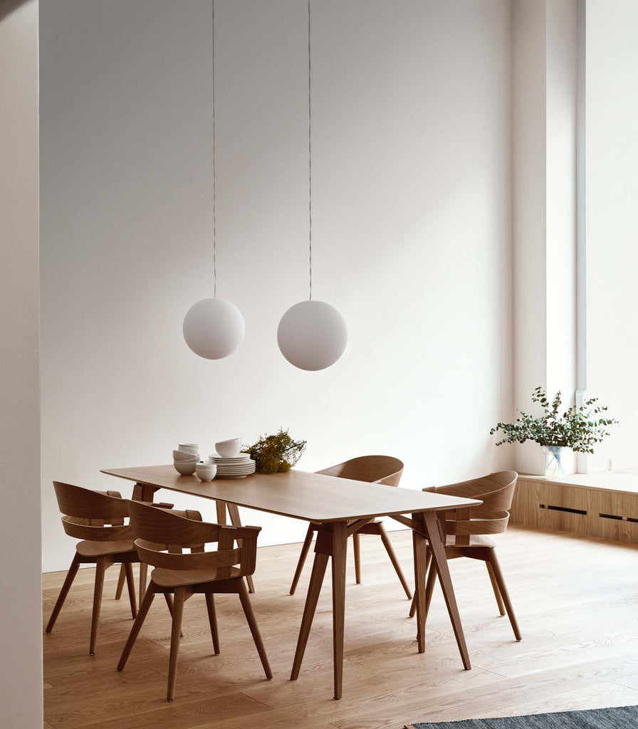 Nordic Fusion Luna Opaque Pendant Light hanging over dining table