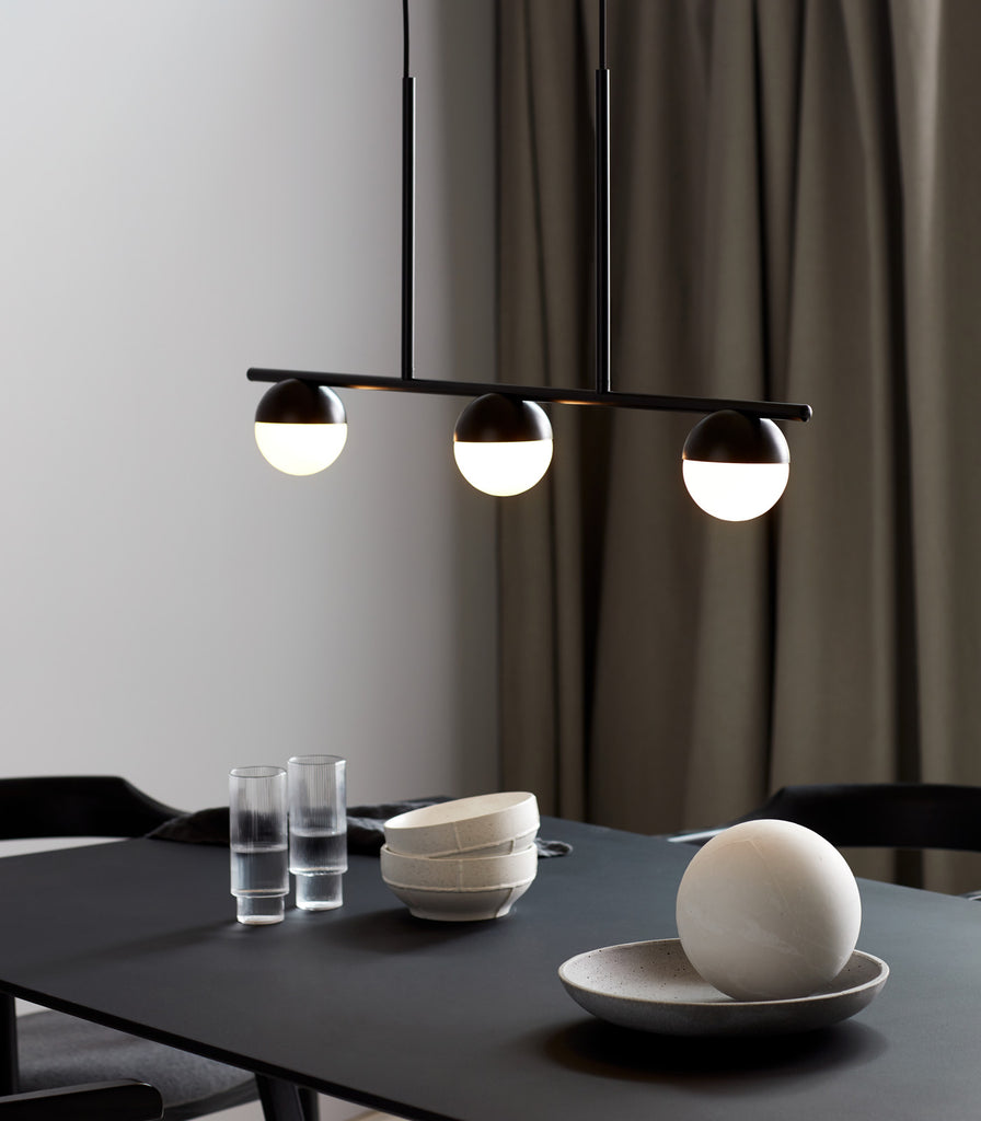 Nordlux Contina 3lt Pendant Light hanging over dining table