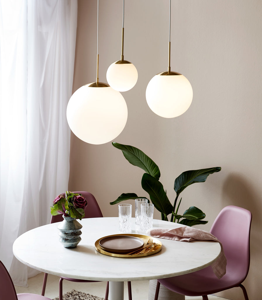 Nordlux Grant Pendant Light hanging over dining table