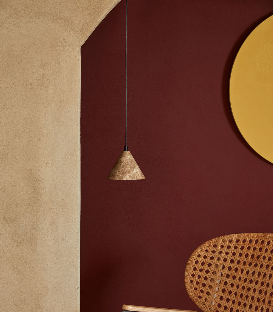 Aromas Iconic Pendant Light hanging in a living room"