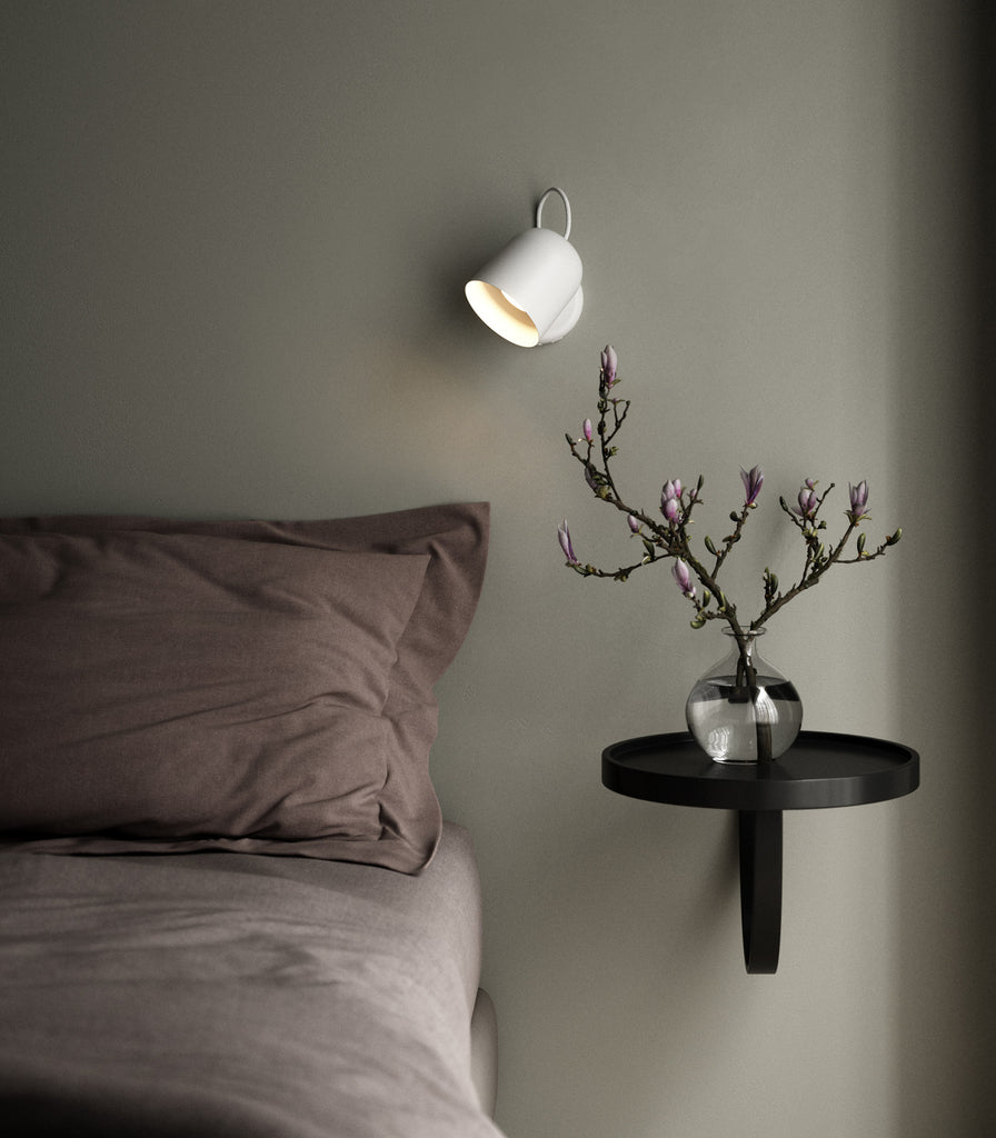  Nordlux Angle Wall Light placed above bedside table