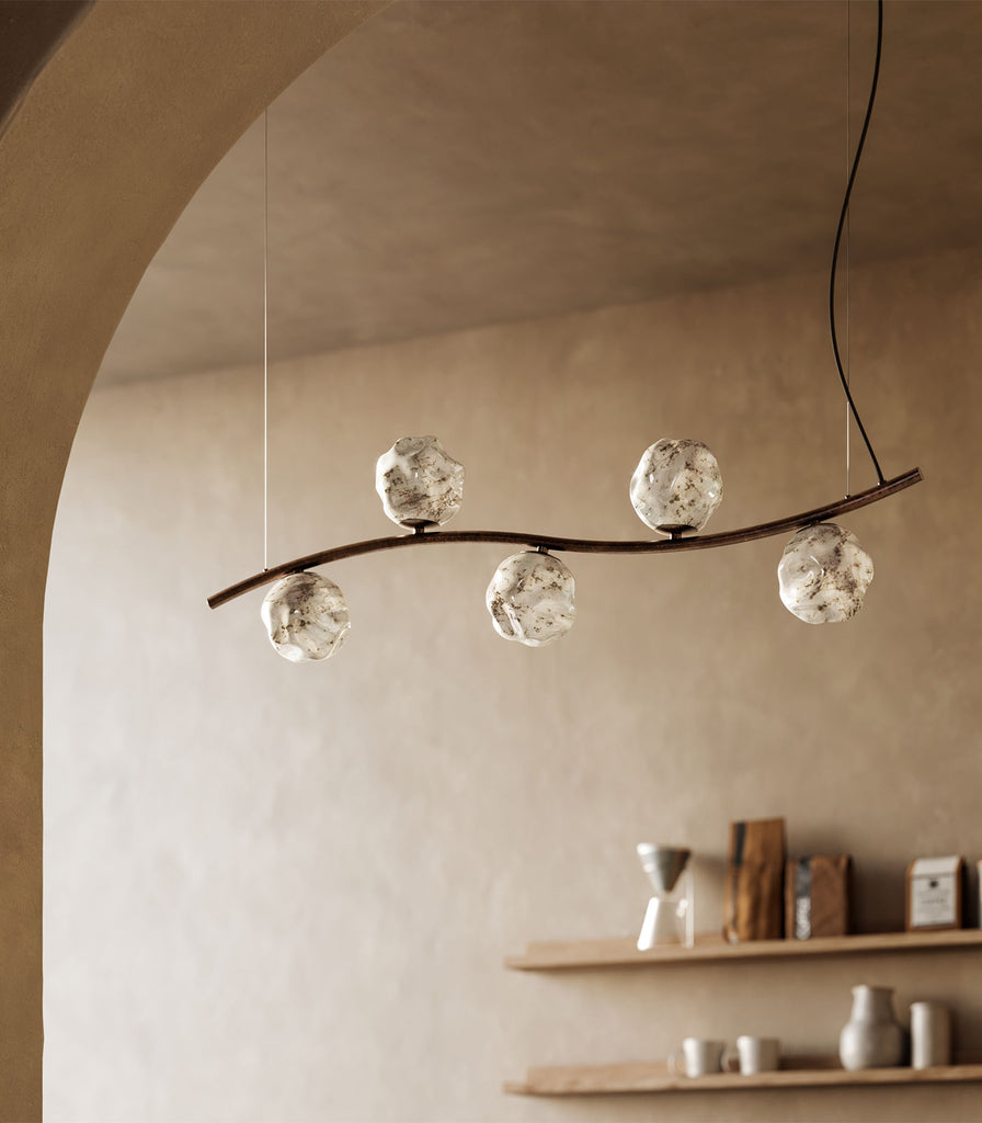Il Fanale Stone Curve Linear Pendant Light featured within interior space