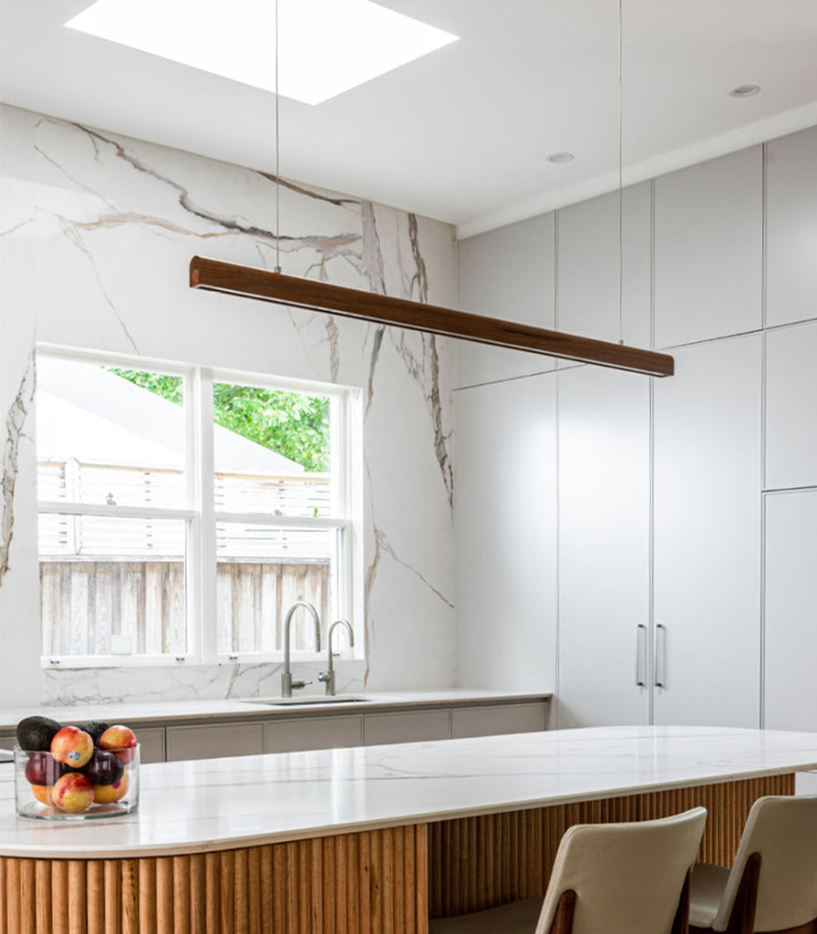 Fluxwood Arc Linear Pendant Light hanging over Kitchen bench