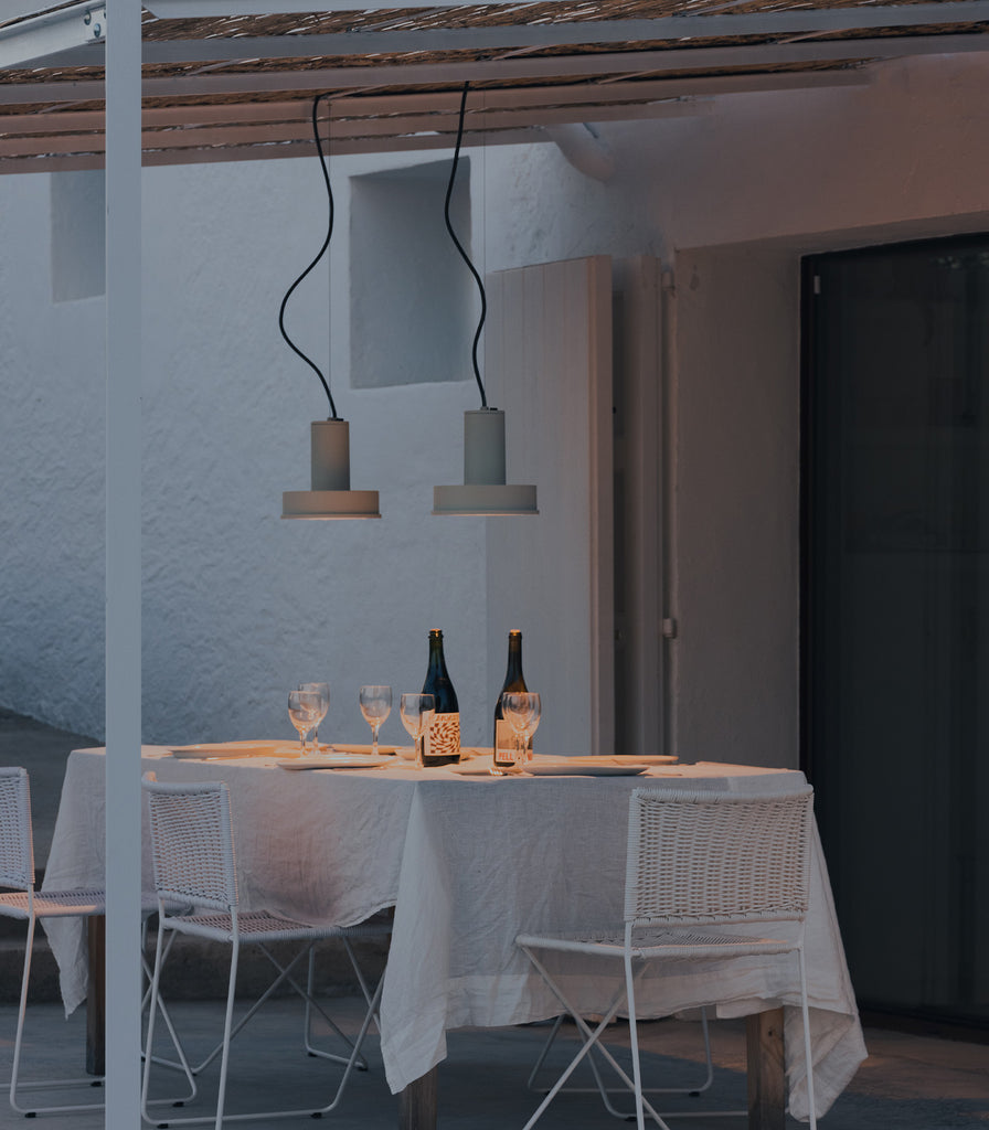 Santa & Cole Arne S Domus Pendant Light featured within outdoor space