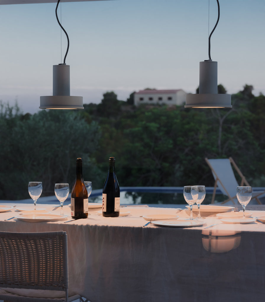 Santa & Cole Arne S Domus Pendant Light featured within outdoor space