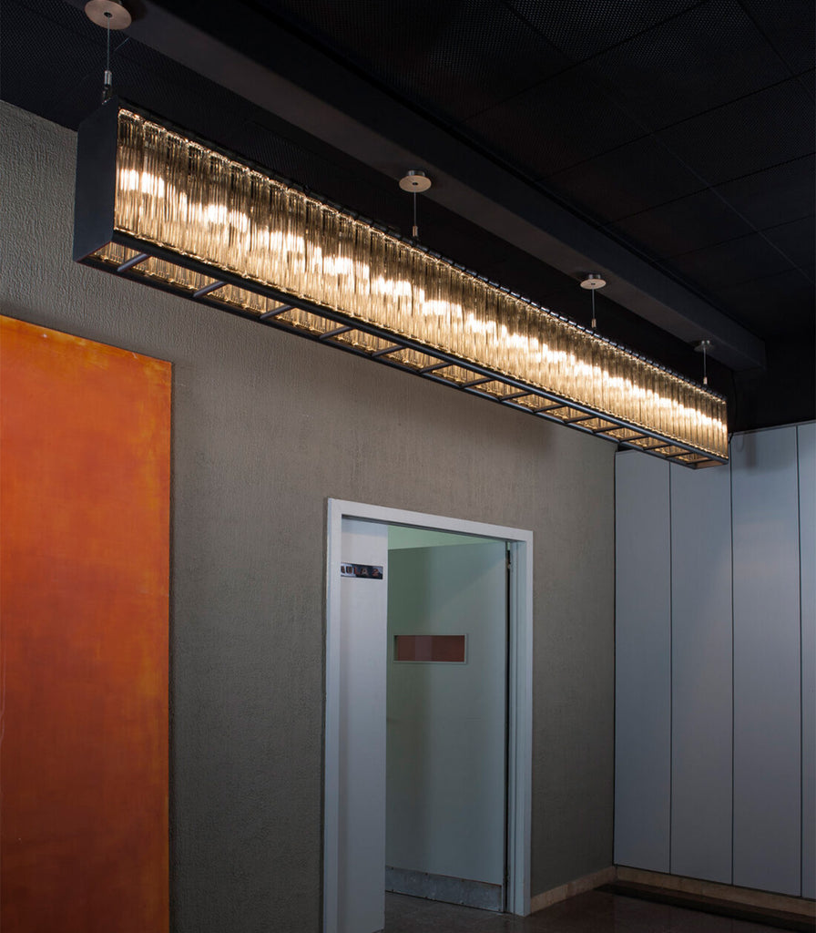 Santa & Cole Estadio Linear Pendant Light featured within interior space