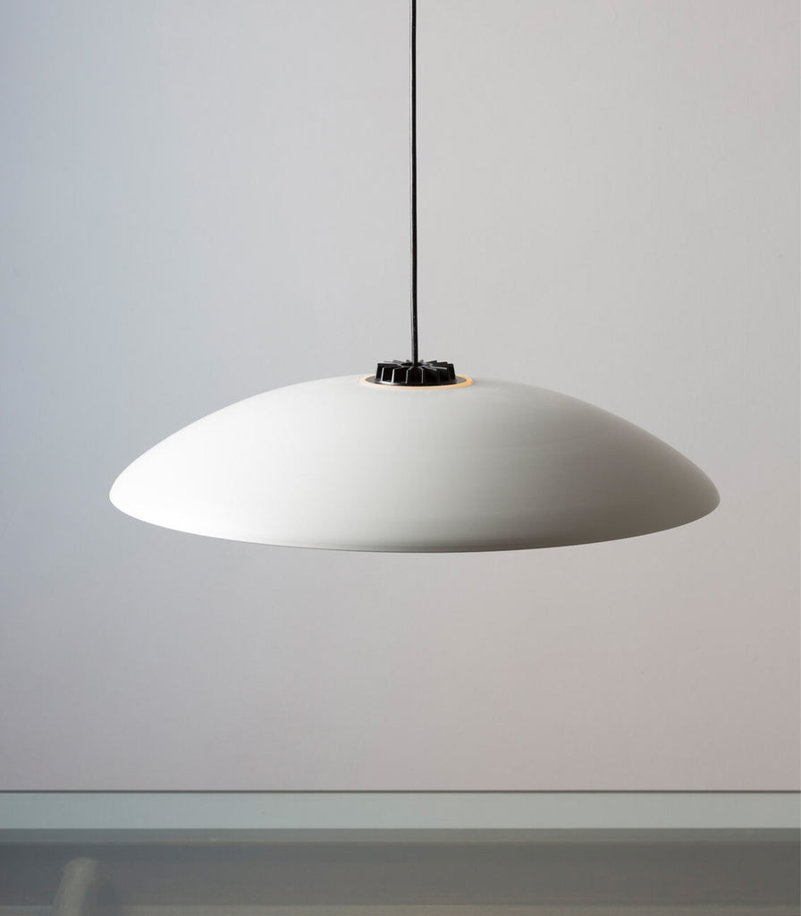 Santa & Cole Headhat Plate Pendant Light featured within interior space