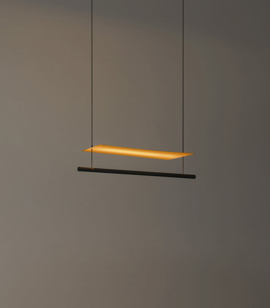 Santa & Cole Lamina Dorada Pendant Light featured within interior space