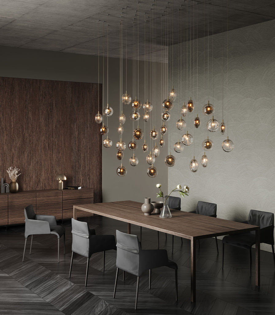 Bomma Lens Pendant Light hanging over dining table