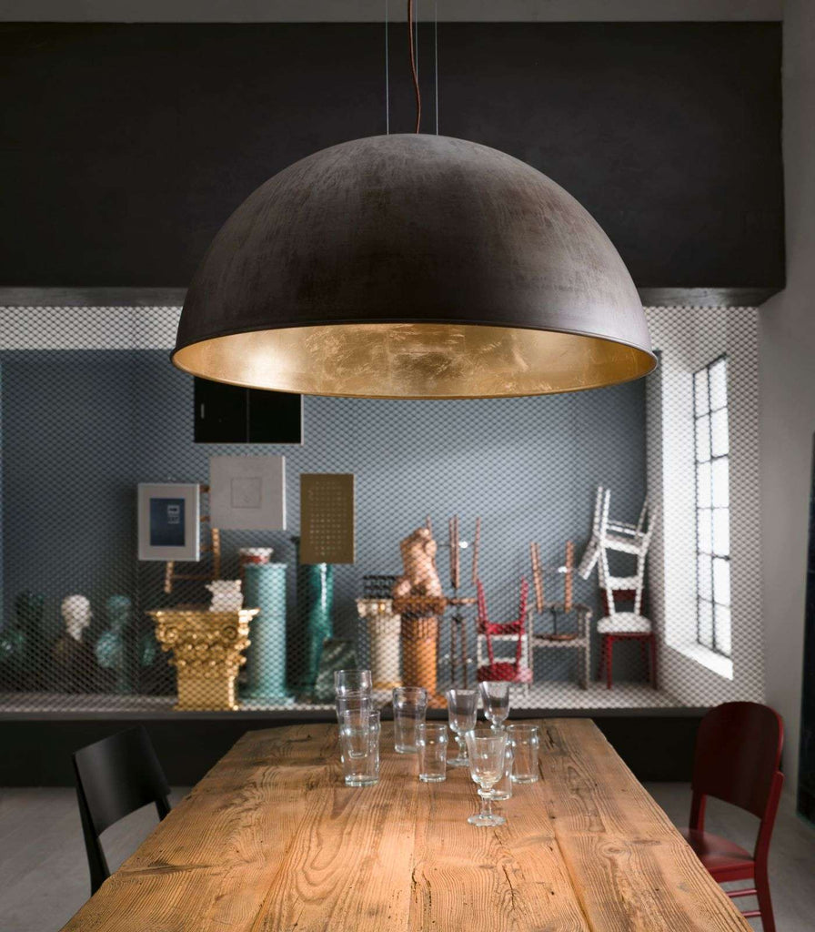 Lighterior Galileo Wire Pendant Light hanging over dining table
