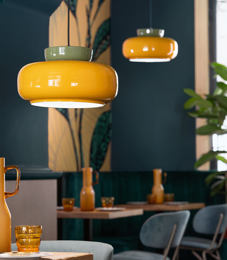 Ferroluce Maracanà Pendant Light hanging over dining table