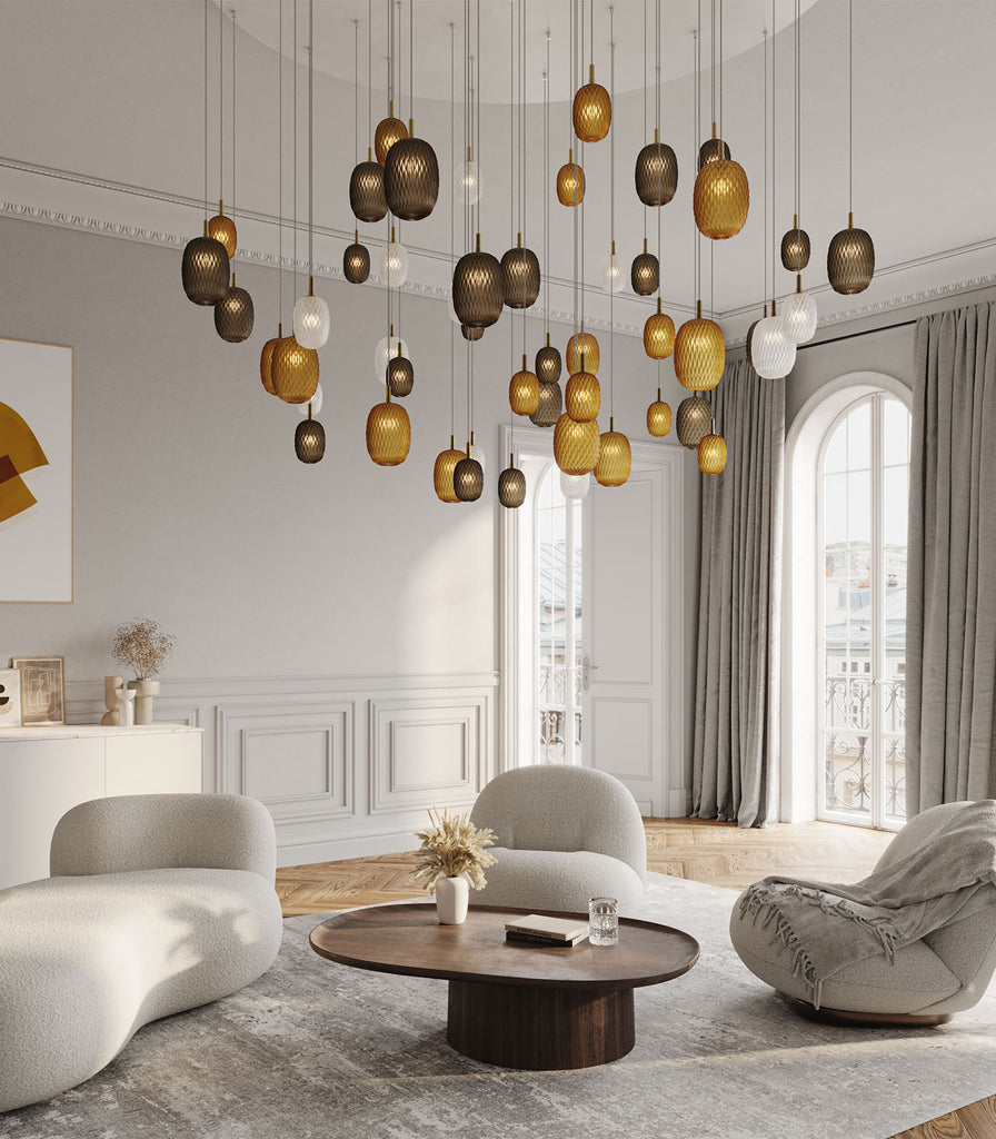 Bomma Metamorphosis Gold Pendant Light hanging in a living room