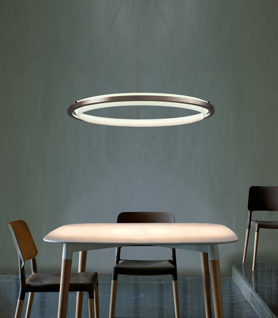 Santa & Cole Nimba Pendant Light hanging over dining table