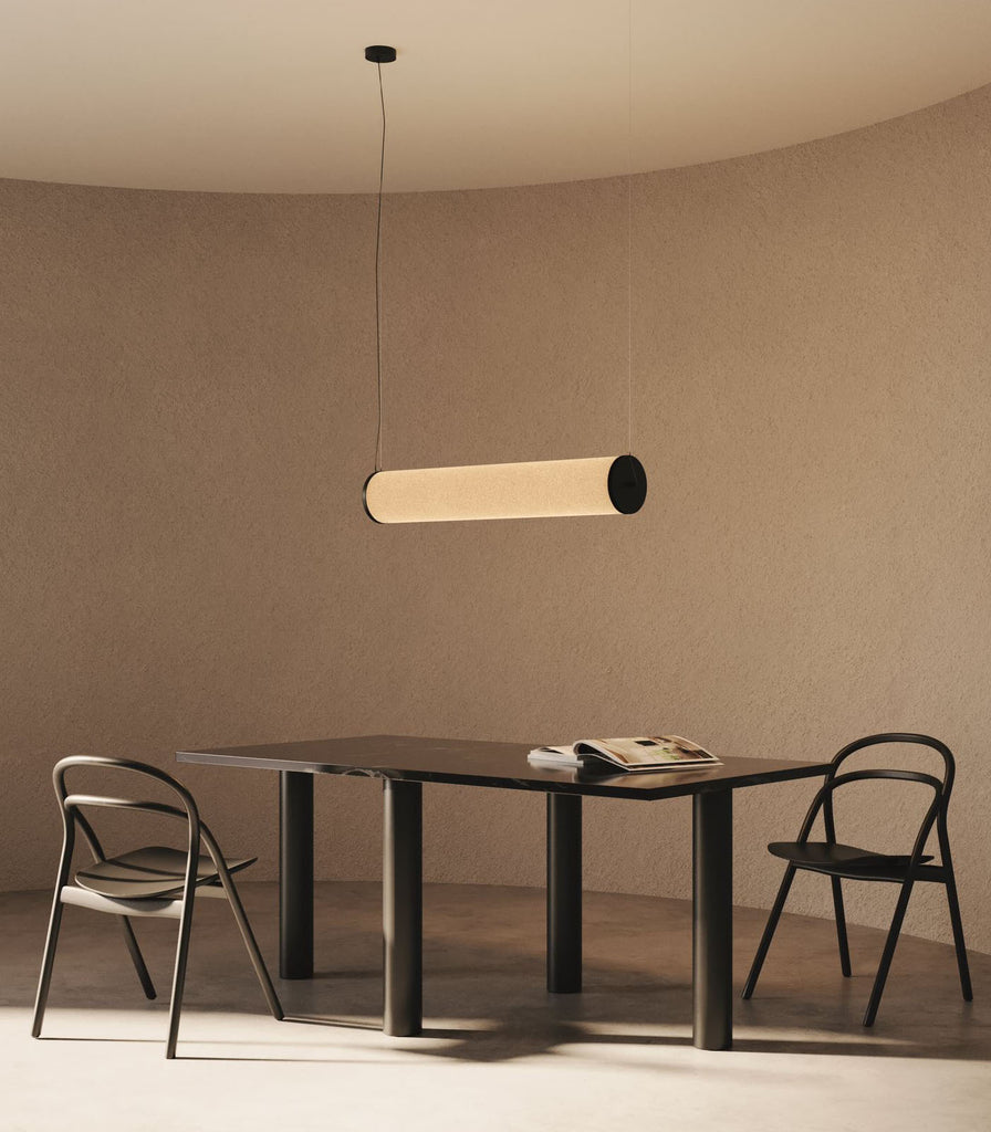 Aromas Nooi Linear Pendant Light hanging over dining table