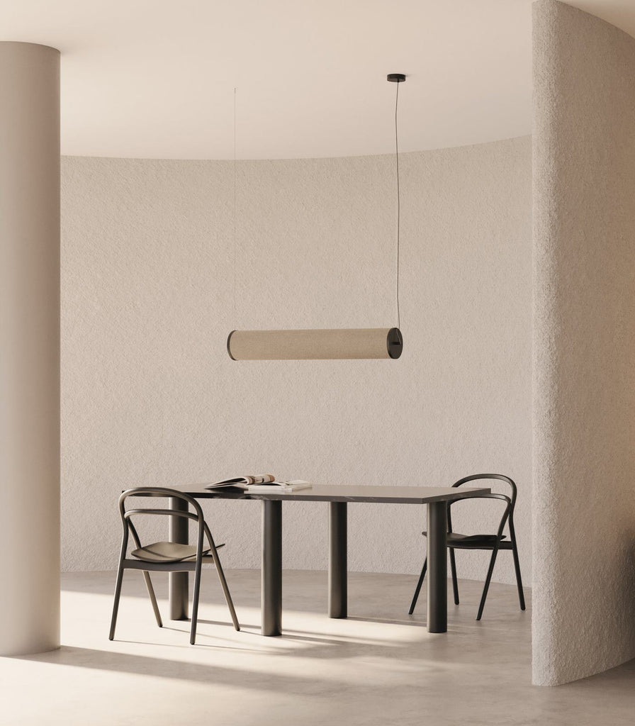 Aromas Nooi Linear Pendant Light hanging over dining table