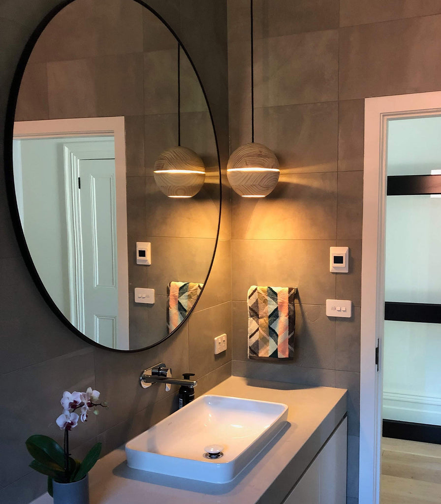 Ilanel Saturn Pendant Light featured in a bathroom