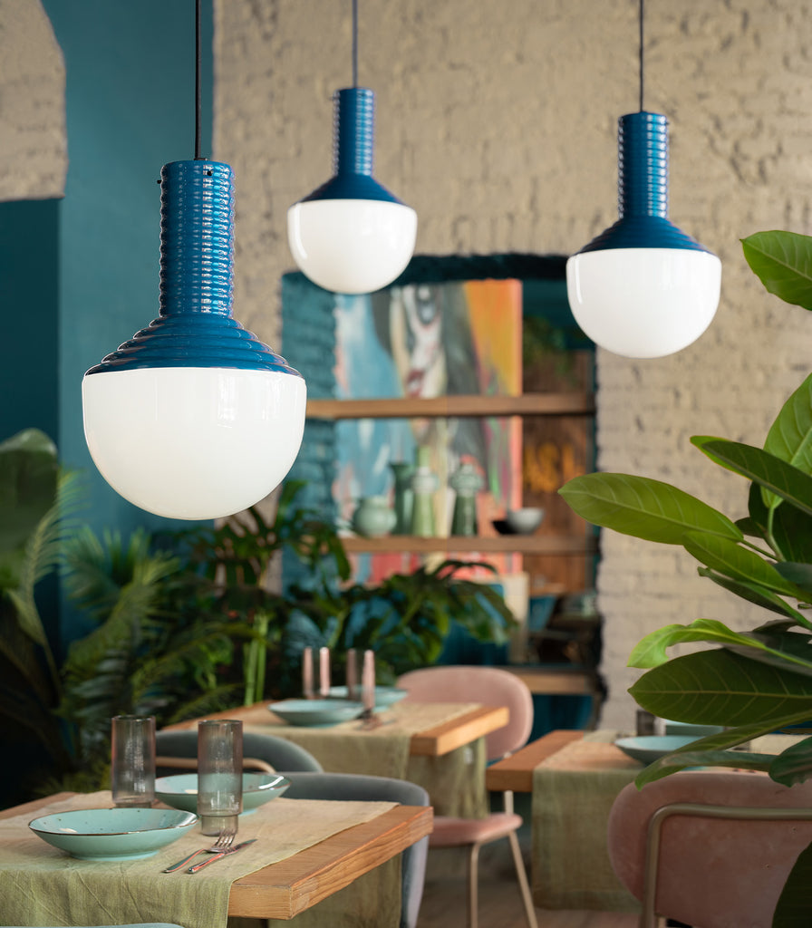 Ferroluce Selaròn Pendant Light hanging over dining table