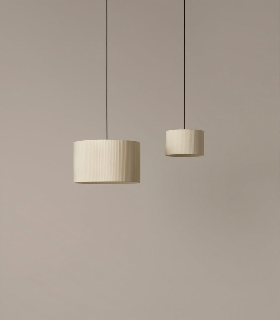 Santa & Cole Sisisi Cilindricas Pendant Light featured within interior space