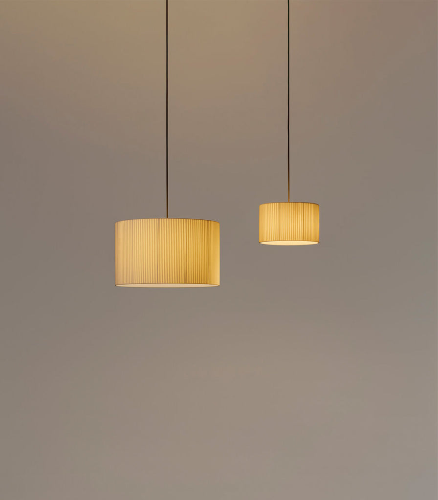 Santa & Cole Sisisi Cilindricas Pendant Light featured within interior space