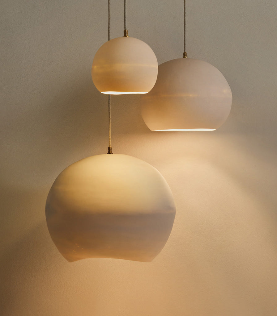 Studio Enti Orb Ceramic Pendant Light featured within interior space