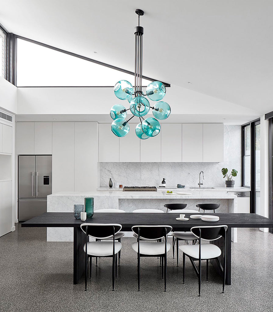 Ilanel Tree Of Light Pendant Light hanging over dining table in Black Ace/ Teal gloss