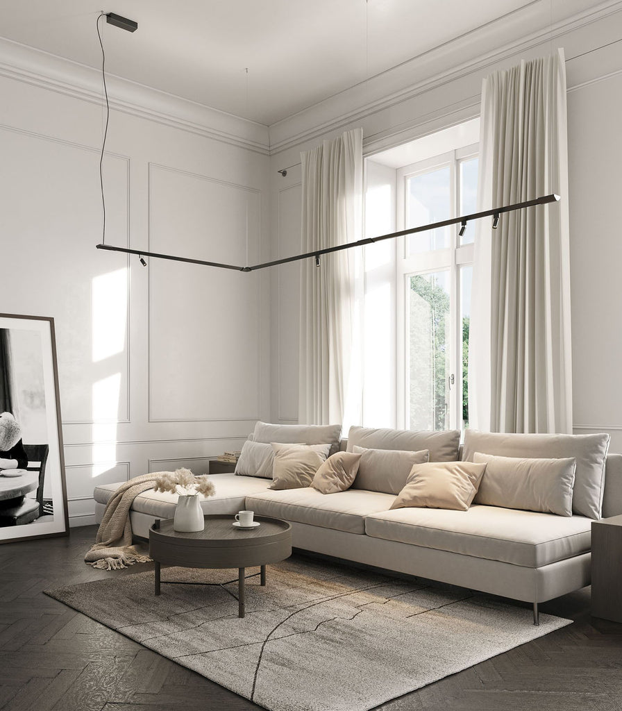 Karman Turn It Linear Pendant Light featured within interior space