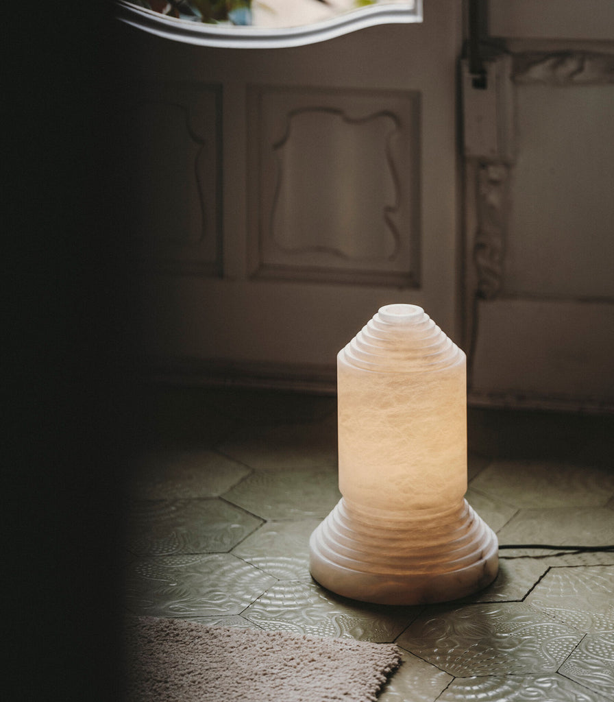 Santa & Cole Babel Alabaster Table Lamp featured within interior space