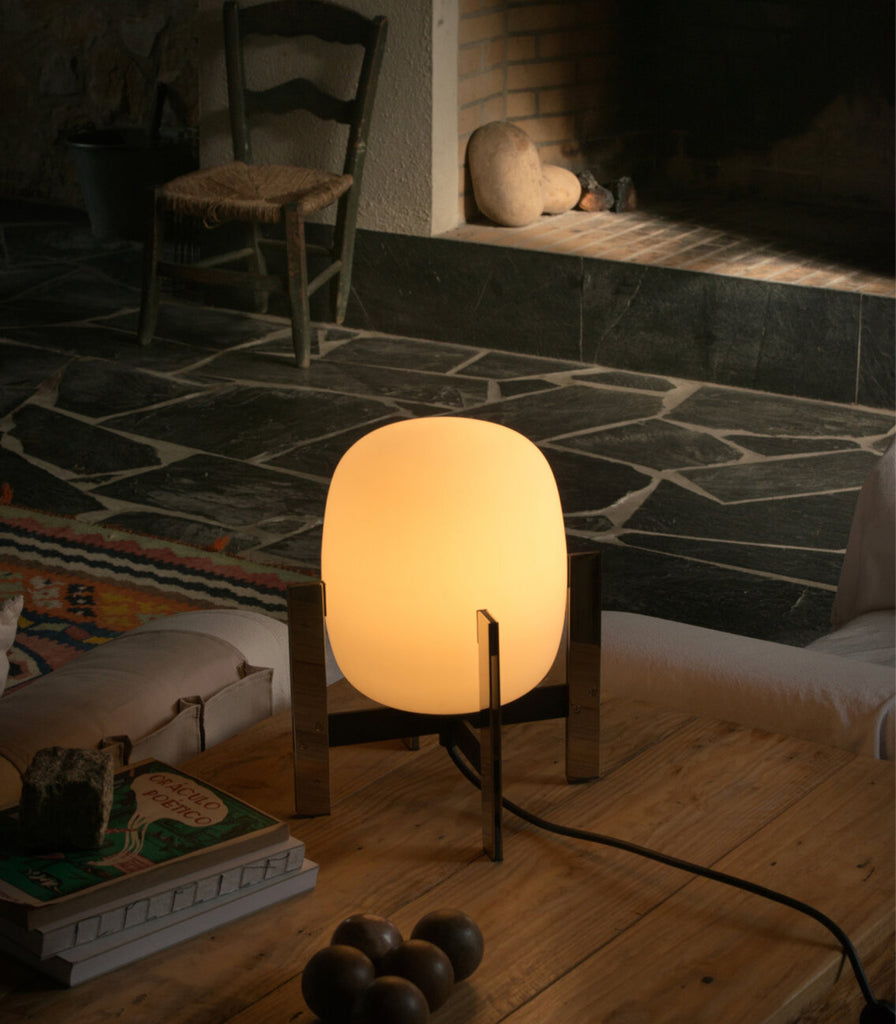 Santa & Cole Cestita Metalica Table Lamp featured within interior space