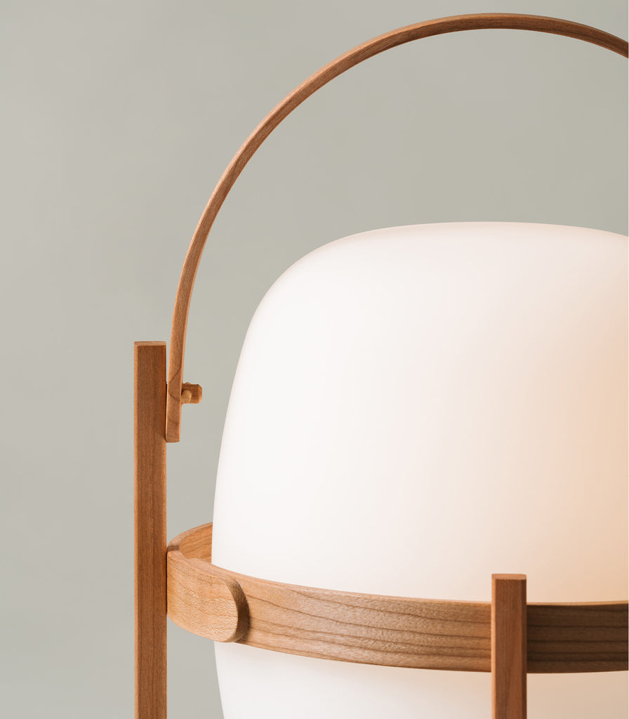 Santa & Cole Cestita Portable Table Lamp featured within interior space