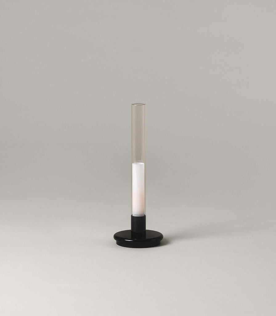 Santa & Cole Sylvestrina Portable Table Lamp featured within interior space