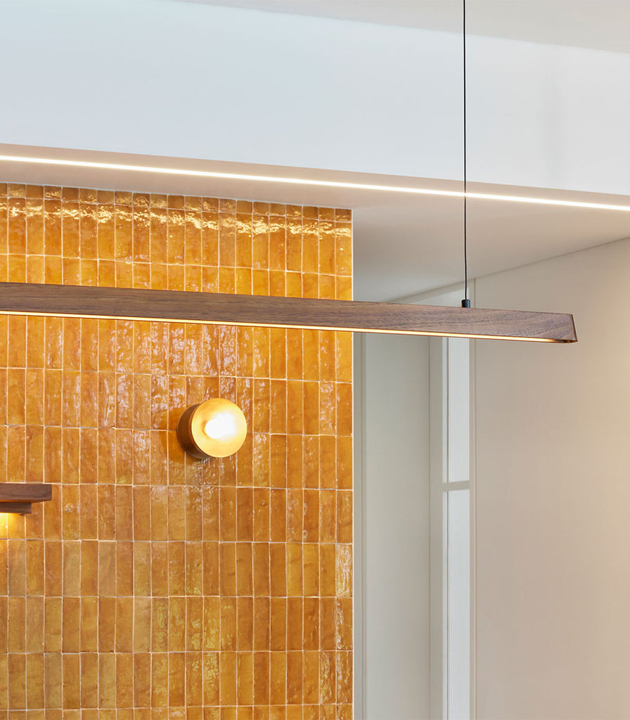 Fluxwood Tenn Linear Pendant Light featured within interior space
