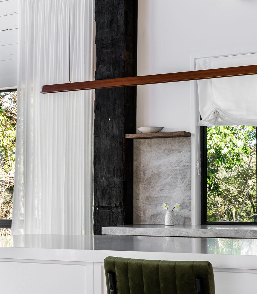 Fluxwood Tenn Linear Pendant Light featured within interior space
