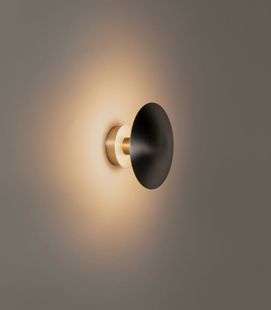 Santa & Cole Disco Wall Light featured within interior space