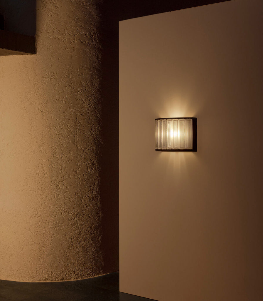 Santa & Cole Estadio Wall Light featured within interior space