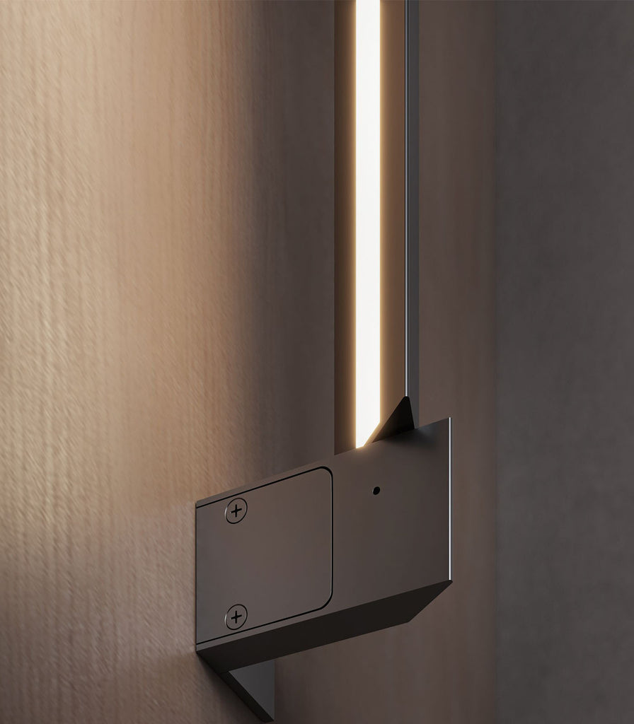 Karman Turn It Wall Light featured within interior space