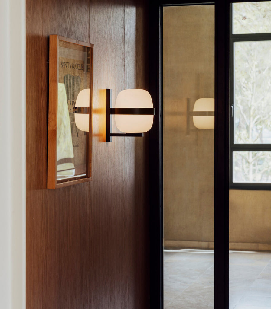 Santa & Cole Wally Cestita Wall Light featured within interior space