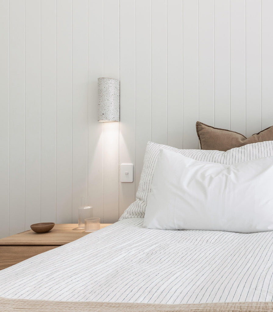 We Ponder Dusk Tall Wall Light featured in a bedroom