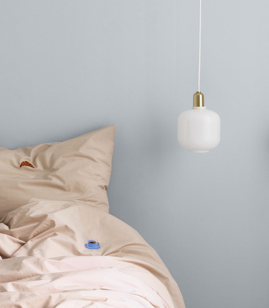 Normann Copenhagen Amp Small Pendant Light featured within interior space