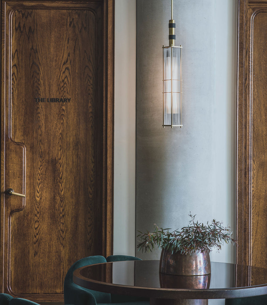 Bert Frank Arbor Pendant Light hanging in a living room