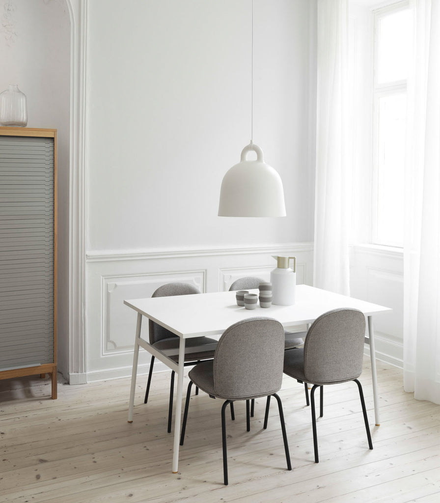 Normann Copenhagen Bell Pendant Light placed over dining table