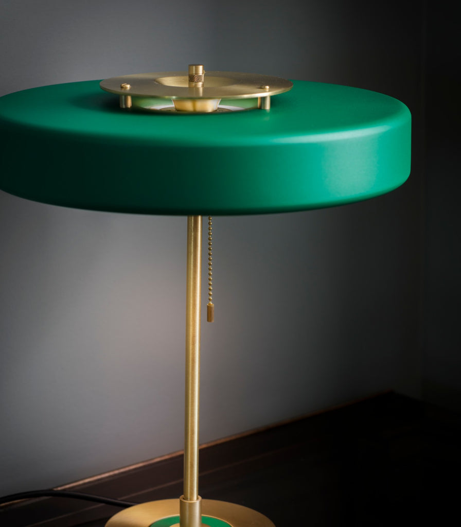 Bert Frank Revolve Table Lamp placed over table