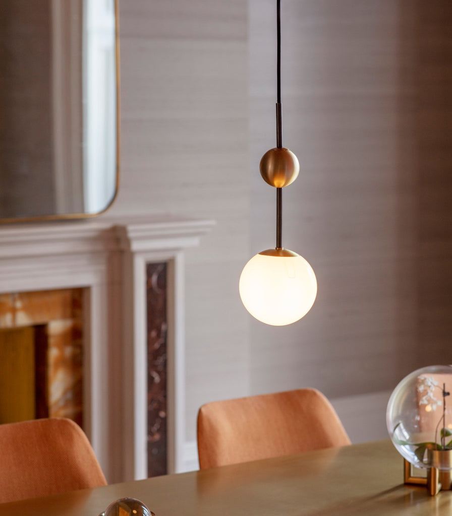 Bert Frank Rift Pendant Light Hanging over dining table