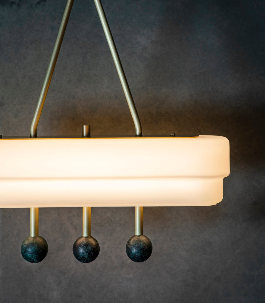 Bert Frank Spate Pendant Light hanging over table close up