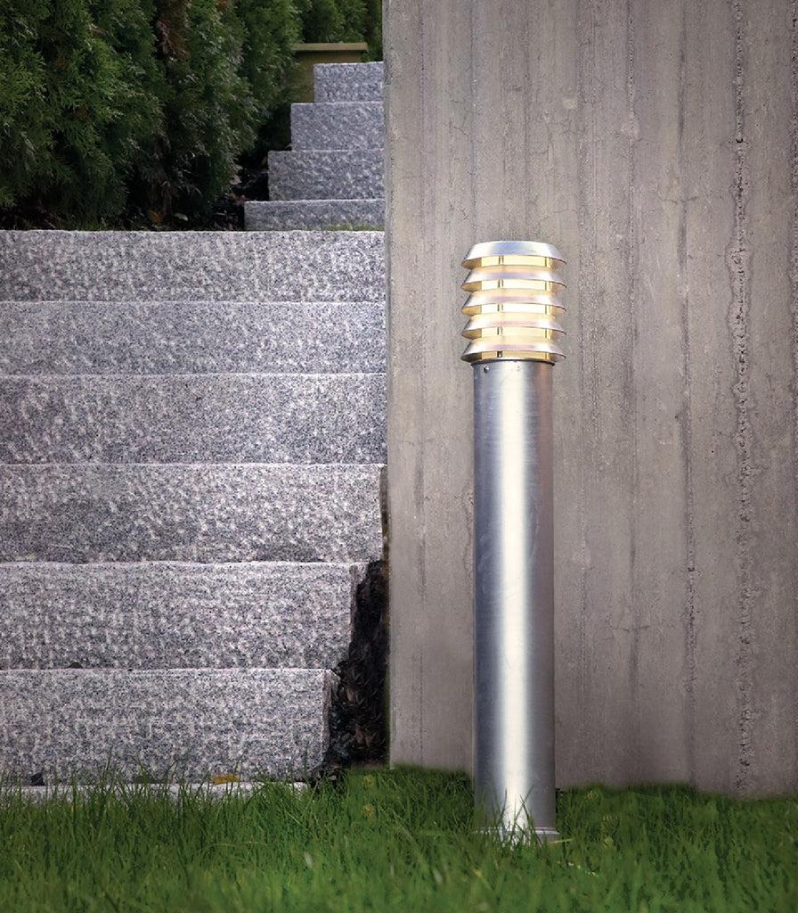 Norlys Alta Bollard Light featured within a outdoor space