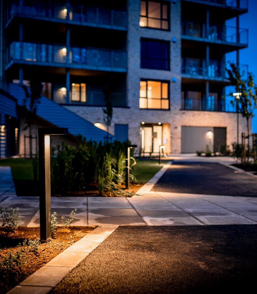 Norlys Asker Bollard Light featured within outdoor space